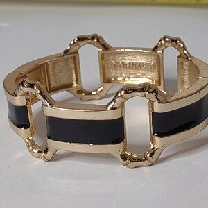 7 Inch Black And Gold Tone Hinged Bracelet